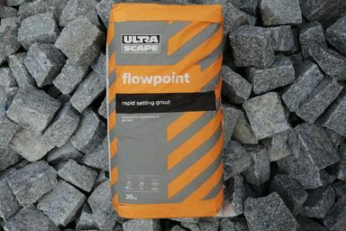 A Bag of Flowpoint laying on granite setts